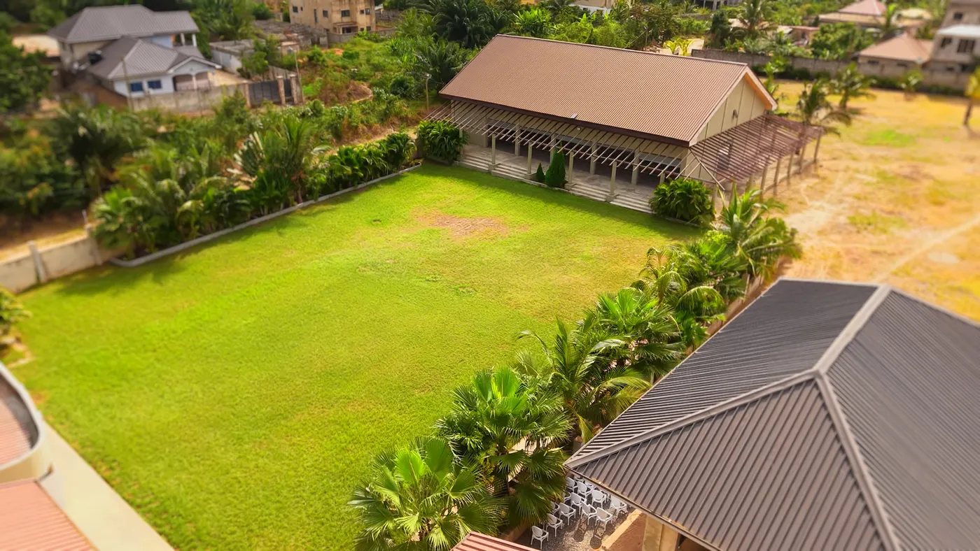 The lawn from above, walled and planted along its edges